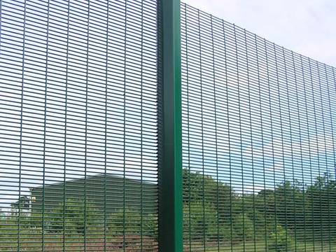 A green PVC coating 3510 high security fence is in the farm.