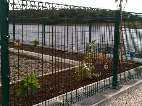 There is a beautiful garden with PVC coating BRC fence surrounding.