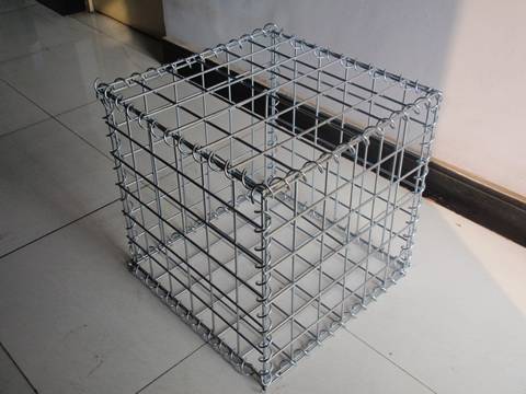 A welded gabion m box are on the ground.