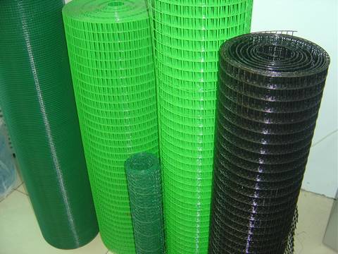 Five rolls of PVC coated welded wire mesh: two rolls in green, two rolls in dark green, and one roll in black.