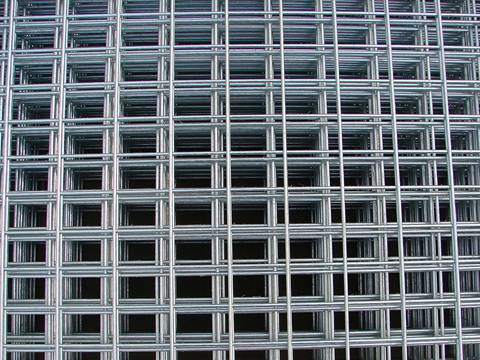 Many sheets of stainless steel welded mesh panel with rectangular holes.