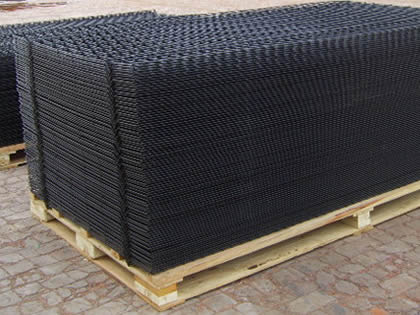 Black PVC welded wire mesh panels packaged on wooden pallets.