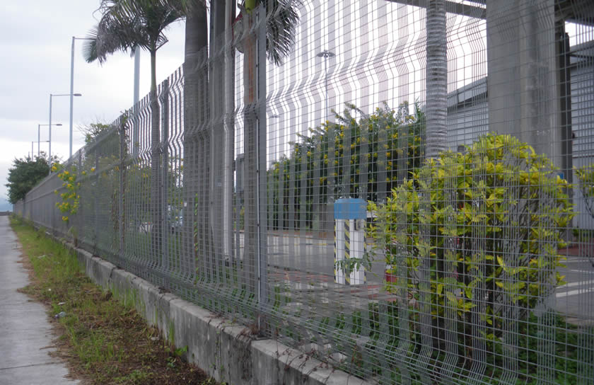 Grey PVC coated welded wire fencing for a factory protection.