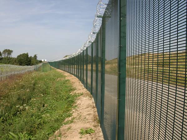  Razor wires are installed at the top of 358 mesh fences outdoors