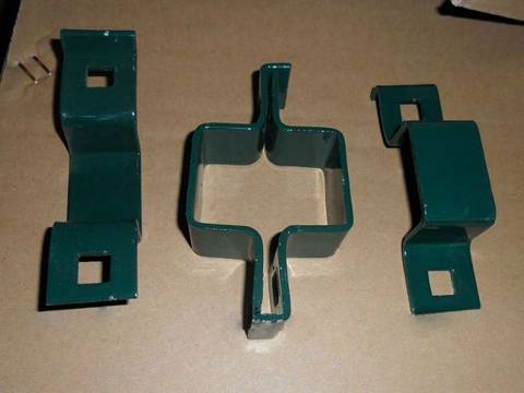 Three green PVC coated fence clips were placed on the carton.