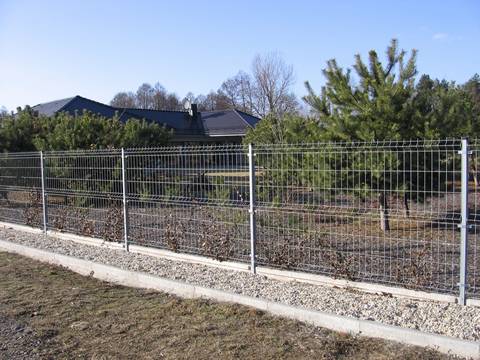 Part of the ground is concrete, and the other part is general land, curvy fence panels are installed on the concrete.