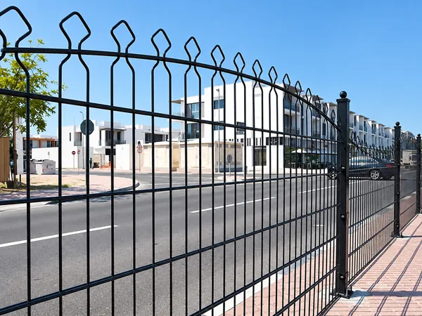 Decorative double wire fence installed in a residential area.