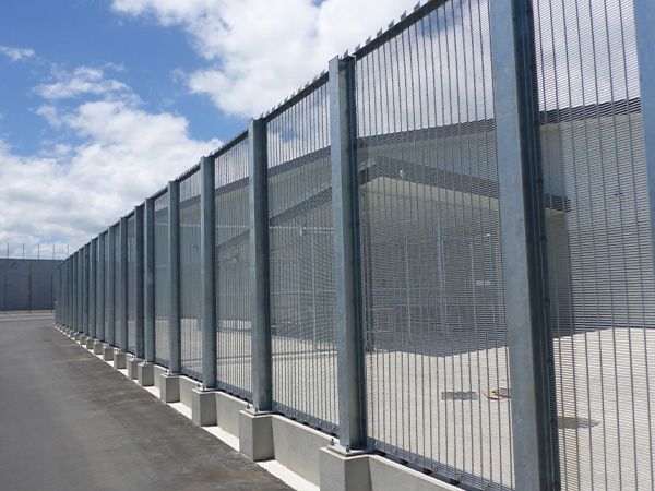 Outside of the factory is fenced with double vertical wire 358 fence.
