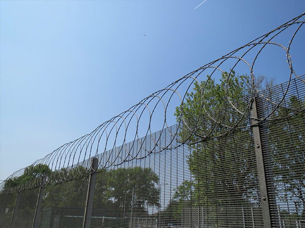 358 high security fence with flat wrap razor wire on top.