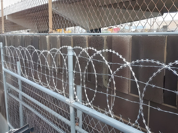 Flat wrap razor wire installed on the edge of the fence.