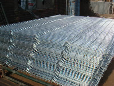 Many pieces of galvanized welded sheet with heaves at intervals.