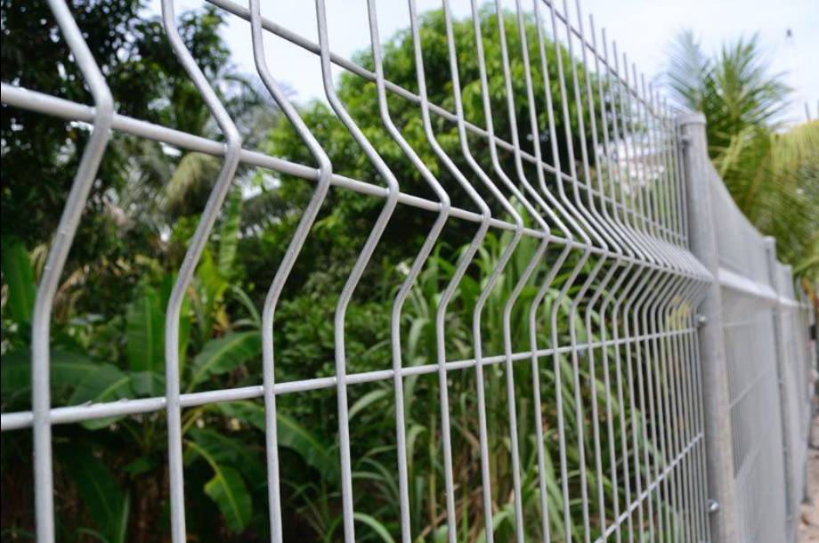 A corner of galvanized welded mesh panel is used as security fence.