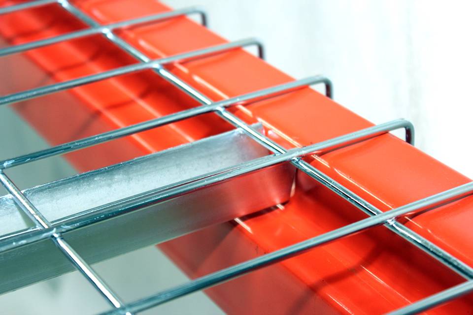 A galvanized wire mesh decking is installed on an orange metal support.