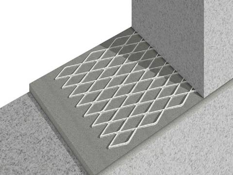 The expanded metal mesh is between the two concrete bricks.
