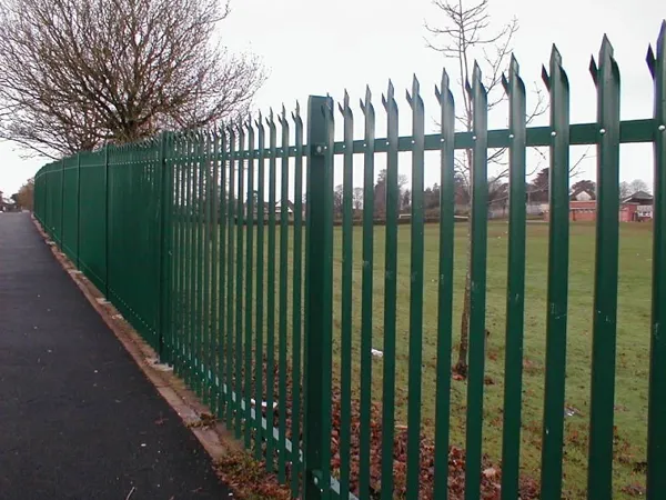 The green palisade fence outside the park.