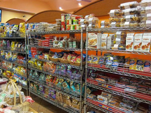 Wire shelving full of food placed in the retail store.