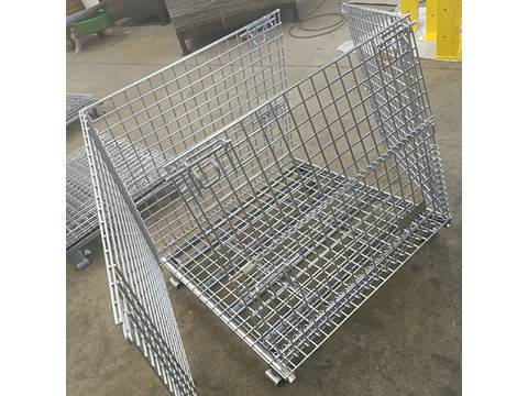 A silver wire container with two swing gates open on opposite sides on ground.