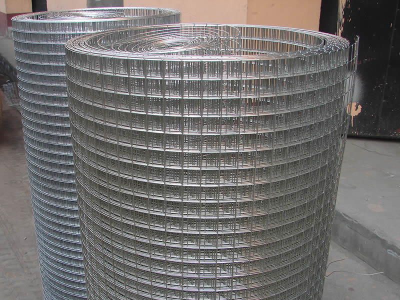 Two rolls of galvanized welded wire mesh with square holes.