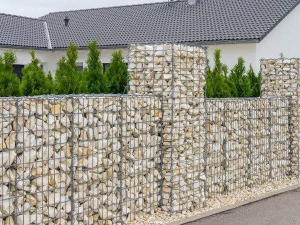 Welded gabion wall is built along the road.
