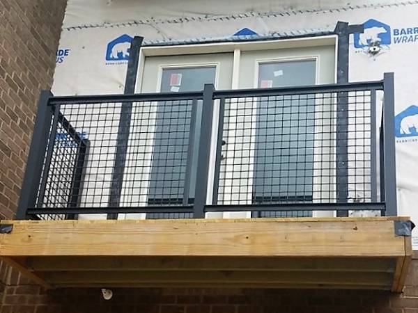 The welded mesh infill panels are installed on the balcony
