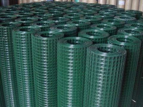 Several rolls of PVC coating welded wire mesh rolls on the ground.
