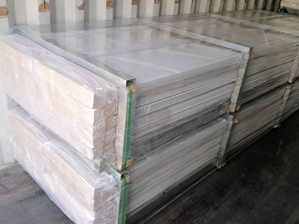Two pallets of wire closet shelving in the container.