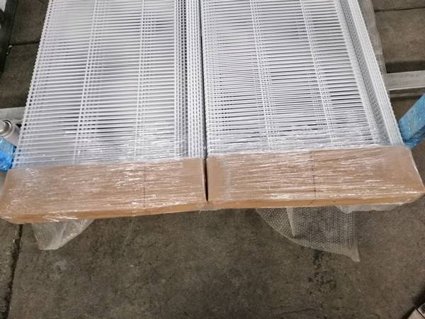 Two pallets of wire closet shelving with plastic film and pallet package.